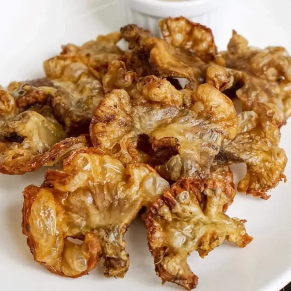 A pack of JM Online Chicharong Bulaklak (ready to fry) frozen, showcasing the irresistible Filipino delicacy.
